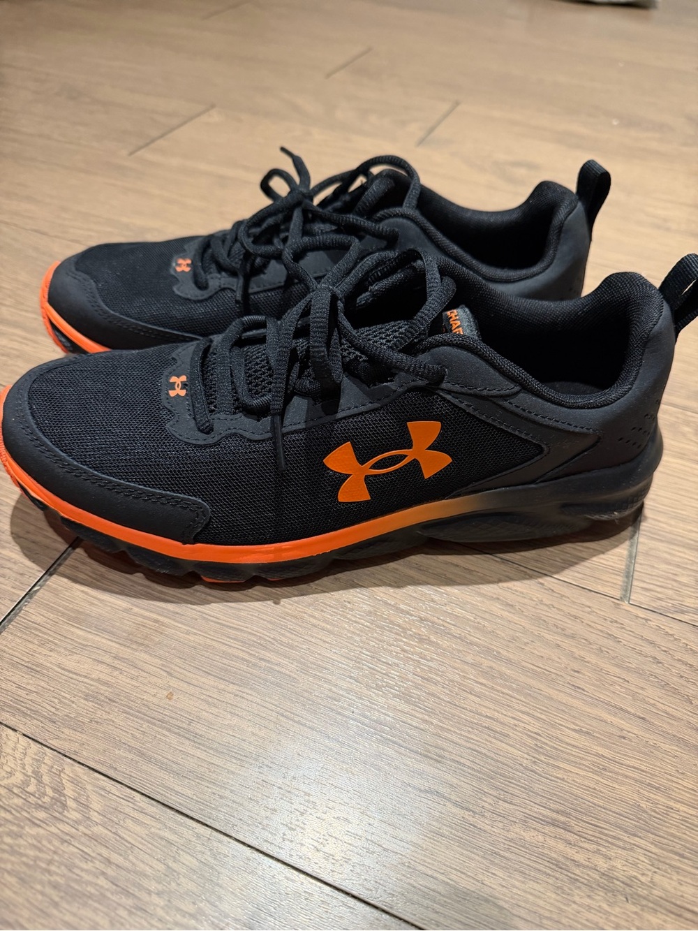 Under Armour Black Athletic Shoes with Orange Accents